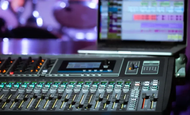 Professional audio mixing console in an AV control setup