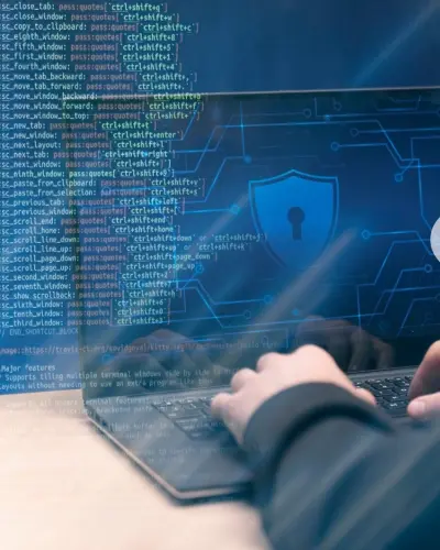 Hands typing at a keyboard with a security shield overlaid on streaming code